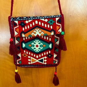 Handmade purse with tassels.